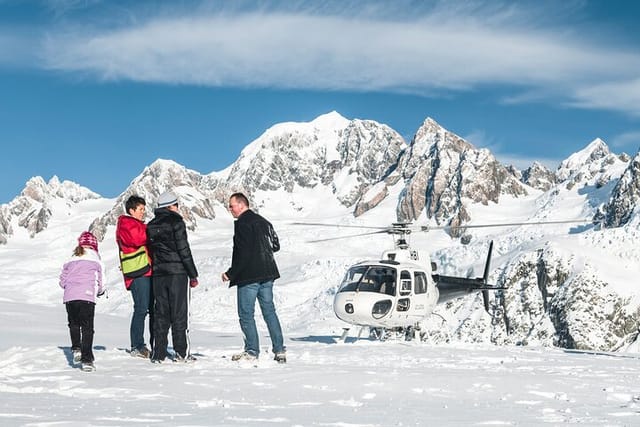 Snow landing on the Fox Glacier Neve, Mt Tasman in view